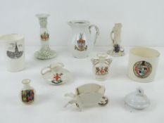 Nine items of assorted Crested ware.