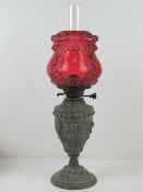 A cranberry glass and spelter Victorian