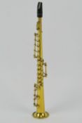 A miniature brass clarinet in case, appr