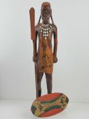 A carved wooden figurine of a tribesman