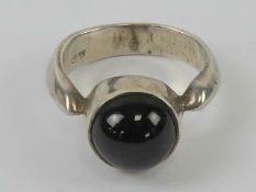 An onyx ring, size M-N, stamped 925.