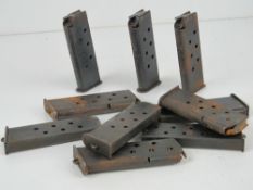 Ten WWII Tokarev pistol magazines.