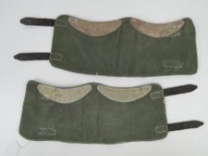 Three pairs of military gaiters, a post war German side cap,