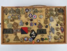 A collection of military and public sector badges inc;