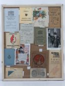 A framed montage of WWII items inc Motorfuel ration book,