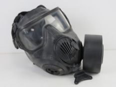 A USA M50 gas mask in box.