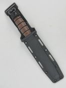 A USMC (US Marine Corp) KA BAR dagger with sheath.