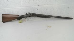 A deactivated British Field's of London double barrel 12 gauge coach hammer shotgun having 20
