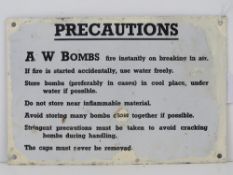 An enamelled tin plate WWII warning sign 'AW bombs fire instantly on breaking in air...