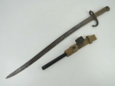 A French 1871 Pattern bayonet, having 57.5cm blade, brass grip and hook quillion.