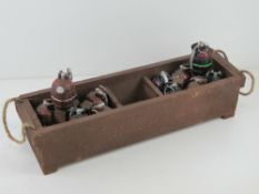 Twelve reproduction inert Mills grenades in transit tray, metal dummies with pins.