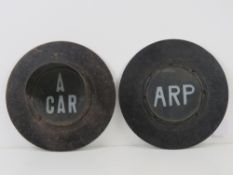 A rare set of WWII light covers being 'ARP' and 'A CAR', each measuring 24.5cm dia.