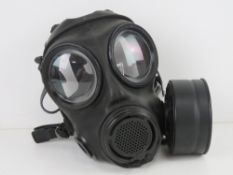 A Chinese Norinco gas mask with filter in box.