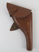 A WWI brown leather holster for the British Webley Mk6, dated 1914 with TJ.