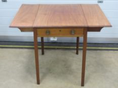 An Edwardian mahogany occasional drop leaf table having single drawer under and raised over four