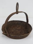 A cast iron swing skillet for an open fire having Swaine mark to base, 8