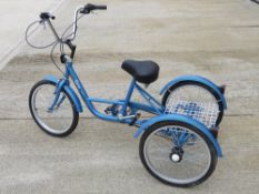 An Aurai Trikes low step frame adult three wheeled bicycle with wire rack behind seat,