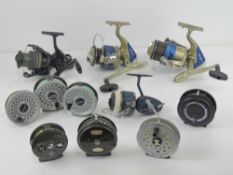 A quantity of assorted fishing reels including; two Motion MT80 reels, a Longbow LB50,