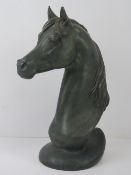 A ceramic sculpture of a horses head, bronzed effect, 39cm high.