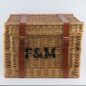 A large (coffee table sized) wicker picnic hamper having F&M painted upon (possibly later addition)