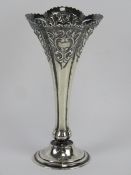 A delightful HM silver bud vase having floral repoussé to the stem and standing 13.