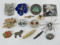 A quantity of 20th century brooches including an 835 silver and marcasite bar brooch, spider,