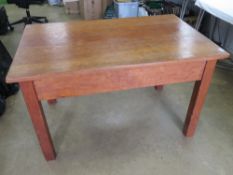 A good solid pine kitchen table raised over square shaped legs, 120 x 76cm, 73cm high.