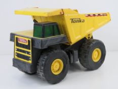 A Tonka dumper truck, plastic and metal, 36cm in length.