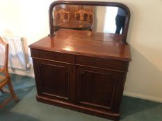 A Victorian mirror back chiffonier having two drawers and two doors, 119 x 52cm, 134cm high.