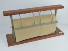 A vintage shop type mahogany wall mounted brown paper dispenser as made by Drayton,