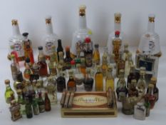 A quantity of assorted liquor miniatures together with five Wade Bells Whisky bottles (one with
