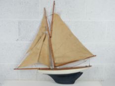 A vintage model sailboat bearing plaque Clyde Model Dockyard & Engine Depot Argill Arcade,