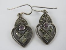 A pair of silver and marcasite earrings,