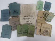 A National Provincial Bank Ltd cloth cash bag containing a quantity of pre-decimalisation coin bags