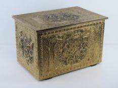 A brass covered log box.