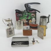 A quantity of pewter and stainless steel hip flasks, together with two tankards,