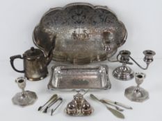 A quantity of assorted silver plated items including large raised galleried tray, cruet set,