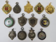 A quantity of assorted sporting medallions including two unengraved silver medallions and one