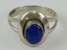 A Native American Navajo style silver ring set with lapis lazuli,