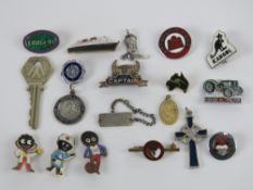 A quantity of assorted enamel badges inc Golden Shred 'Golly' badges etc,