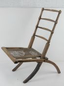 A Victorian wooden framed cane seated campaign chair, a/f.