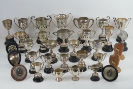 A quantity of thirty-three assorted silver plated engraved trophy cups,