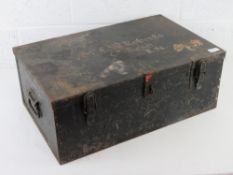 A metal trunk with clasp and end handles marked 'EW Roberts RN' upon, 62 x 39 x 24cm.