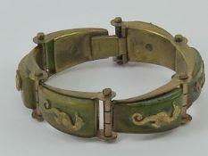 A vintage Jean Painleve Art Deco Seahorse bracelet, having brass motifs on bakelite panels,