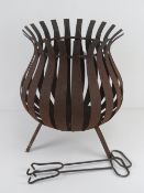 A black painted garden fire brazier, approx 42cm high.