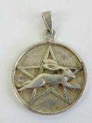 A silver leaping hare and pentagram Wiccan pendant, fertility symbol of Ostara Goddess of Spring,