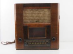 A c1930s vintage Pye radio in half veneered walnut cabinet, 44cm wide, a/f.