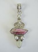 A shell and mother of pearl pendant of abstract form, handmade, stamped 925, 5.5cm in length.