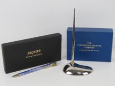 A London Goldsmiths Company silver plated desktop pen and stand.