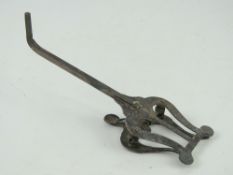 A silver plated brass instrument spring